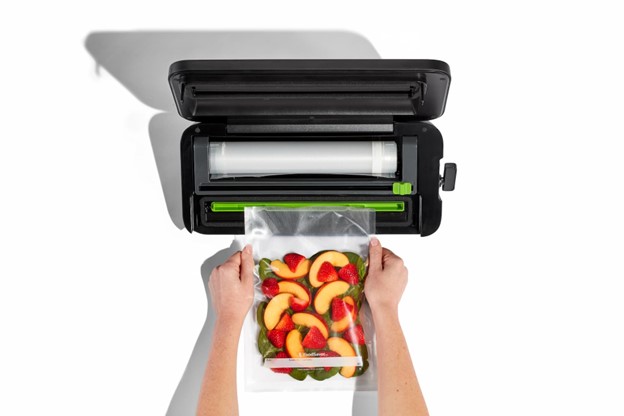 Smoothie ingrediants being saved in FoodSaver Wide-Mouth Jar Sealer